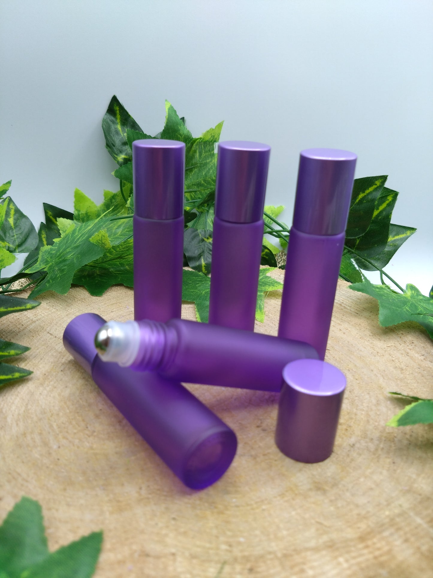 Purple essential oil roller bottle